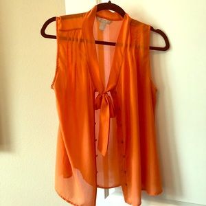 Sheer orange sleeveless top with neck tie